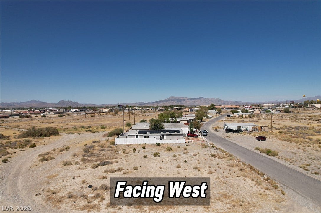 1060 S Firebird Circle, Pahrump, NV 89048 An aerial view showcases the property set against a backdrop of distant mountains.