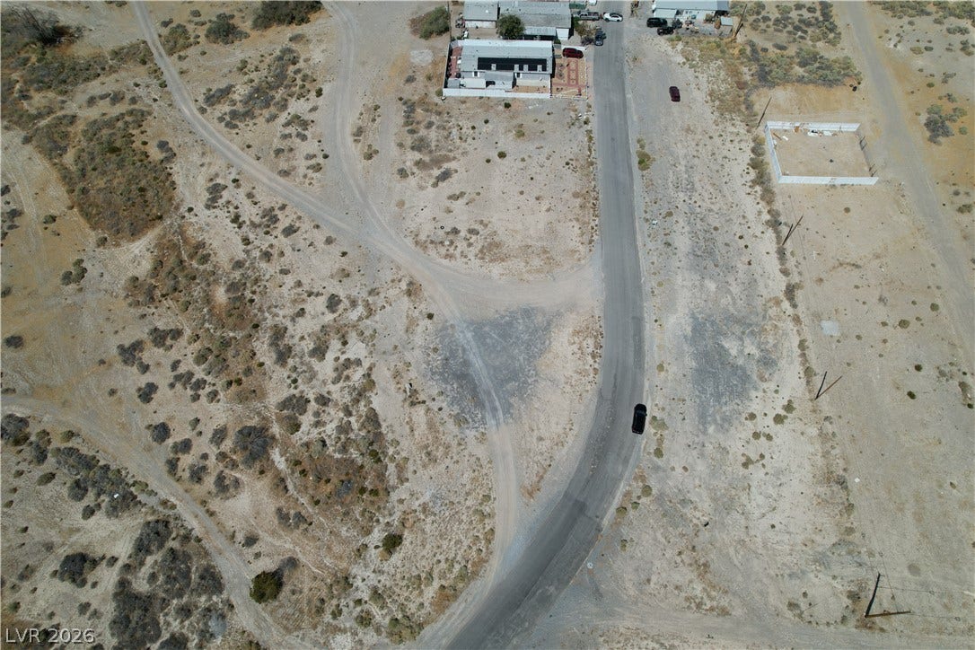 1060 S Firebird Circle, Pahrump, NV 89048 Desert landscapes surround this vast plot of land with nearby road access.