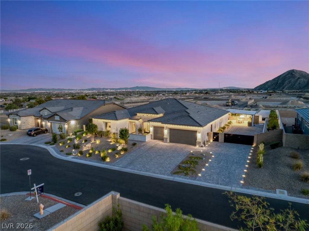 Dramatic mountain and city views frame this modern single-level residence nestled in a quiet cul-de-sac.