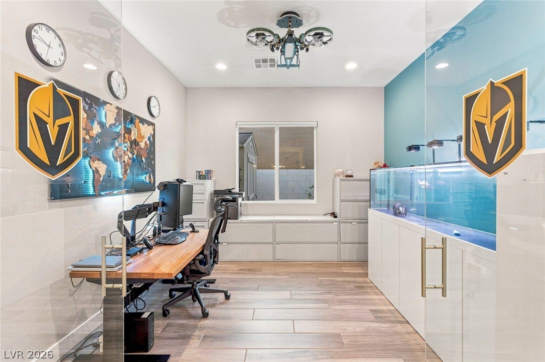 Gleaming tile floors and custom glass partitions define this modern work space.