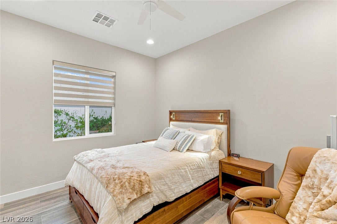 High ceilings and modern plank flooring define this peaceful private retreat.