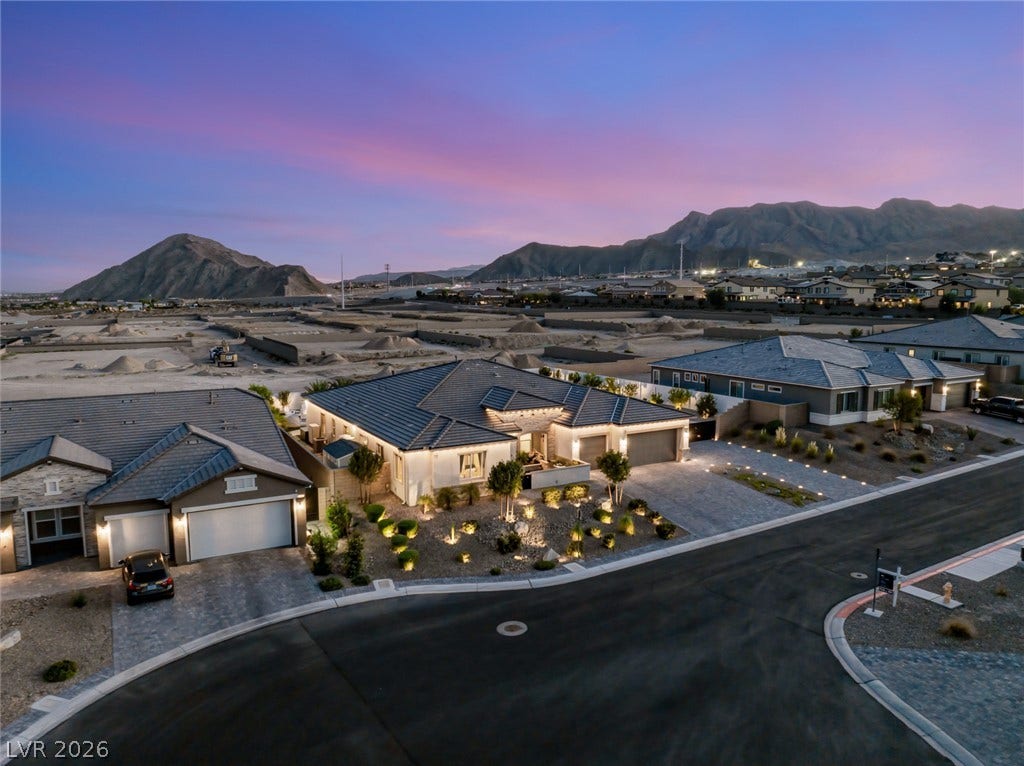 Dramatic mountain vistas frame this contemporary single-level residence nestled along a quiet street.