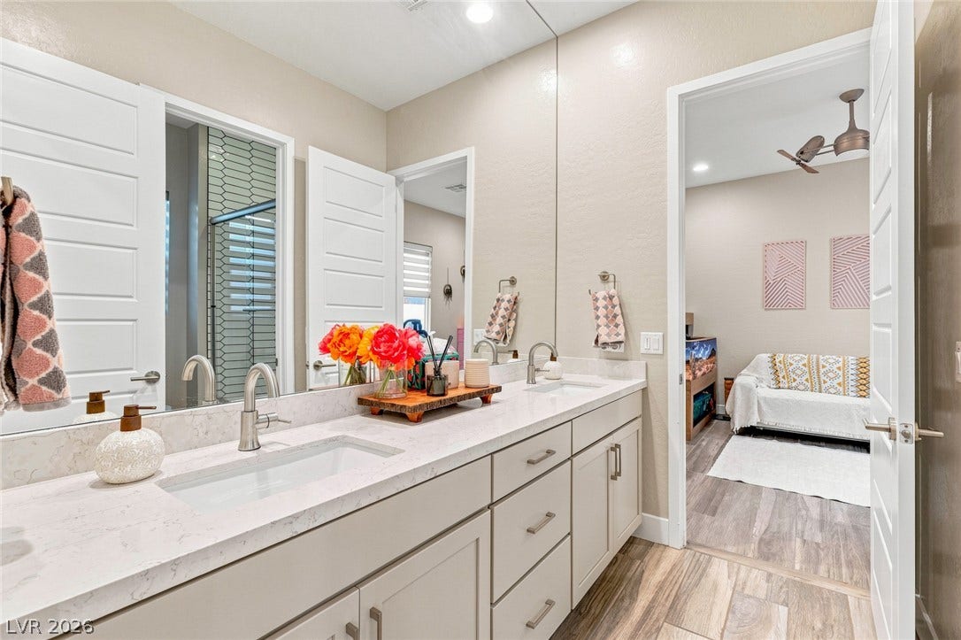 Clean lines and a spacious dual vanity highlight this modern bathroom.