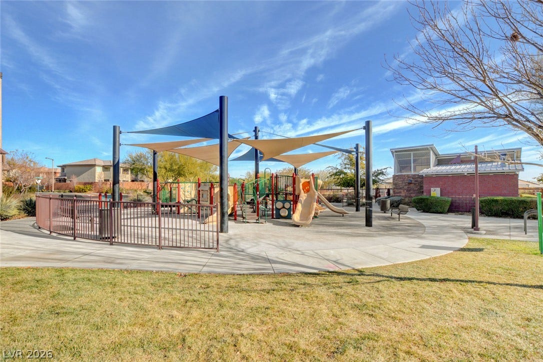 5608 Beckett Hill Court, Las Vegas, NV 89135 Sun shades protect the modern play structures surrounded by curved concrete walkways and manicured lawns.