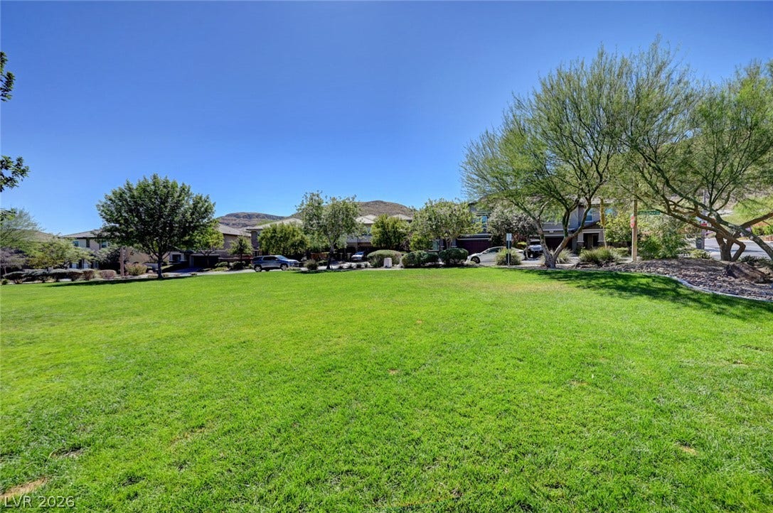 5608 Beckett Hill Court, Las Vegas, NV 89135 Manicured green space integrates beautifully with the surrounding neighborhood architecture.
