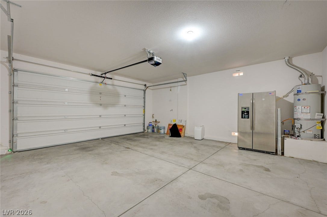 5608 Beckett Hill Court, Las Vegas, NV 89135 An attached garage provides durable concrete flooring and overhead automatic door system.