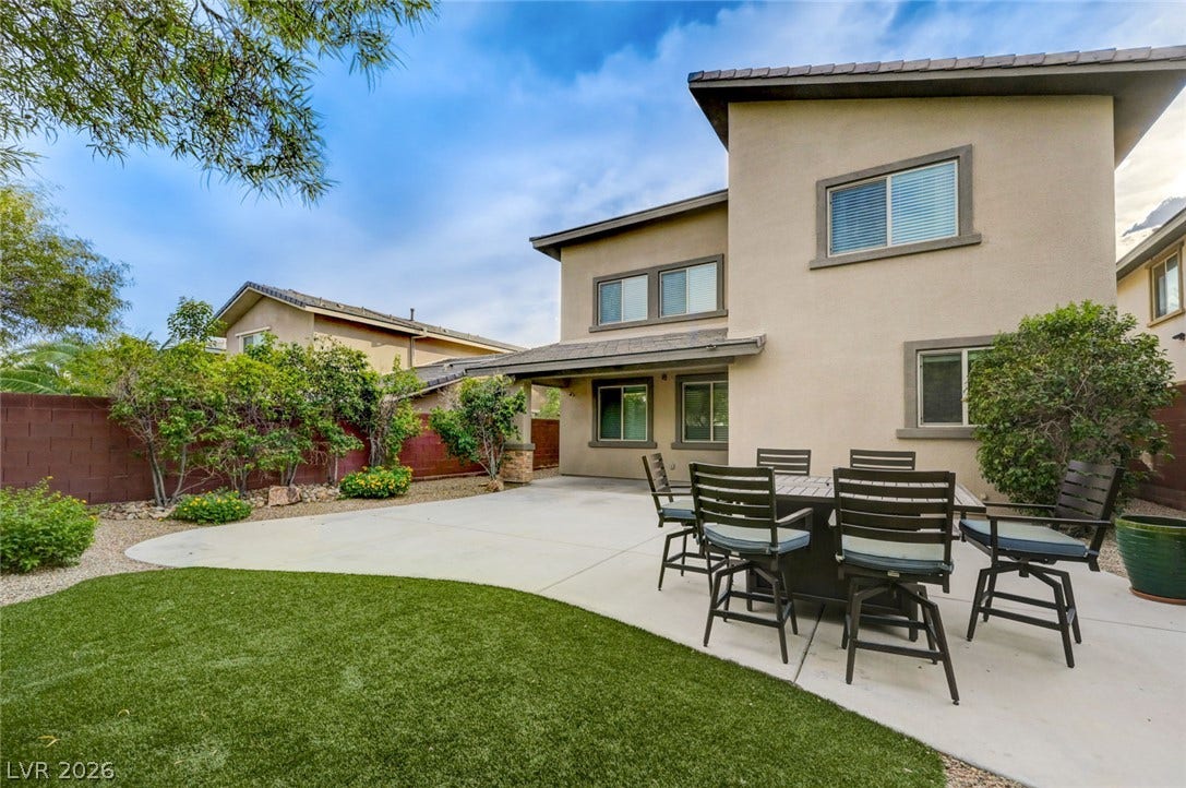 5608 Beckett Hill Court, Las Vegas, NV 89135 A spacious backyard patio integrates seamlessly with the surrounding landscape design.