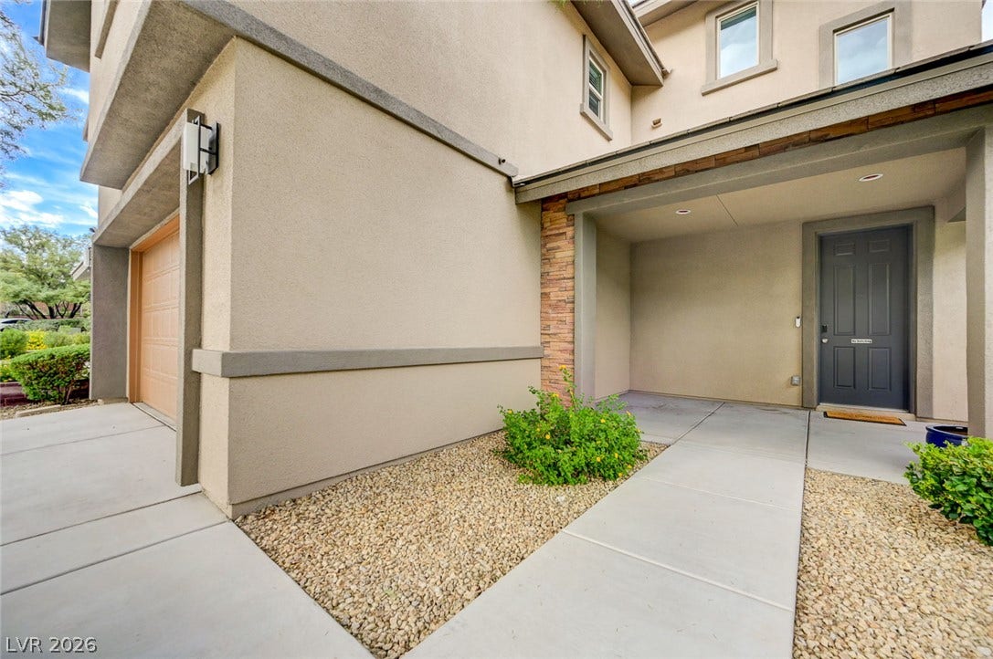 5608 Beckett Hill Court, Las Vegas, NV 89135 Clean modern architectural lines define this welcoming entryway with durable stucco siding and concrete pathways.
