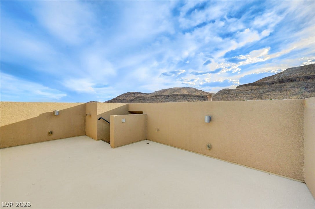 5608 Beckett Hill Court, Las Vegas, NV 89135 Dramatic mountain views frame this private rooftop deck under expansive desert skies.
