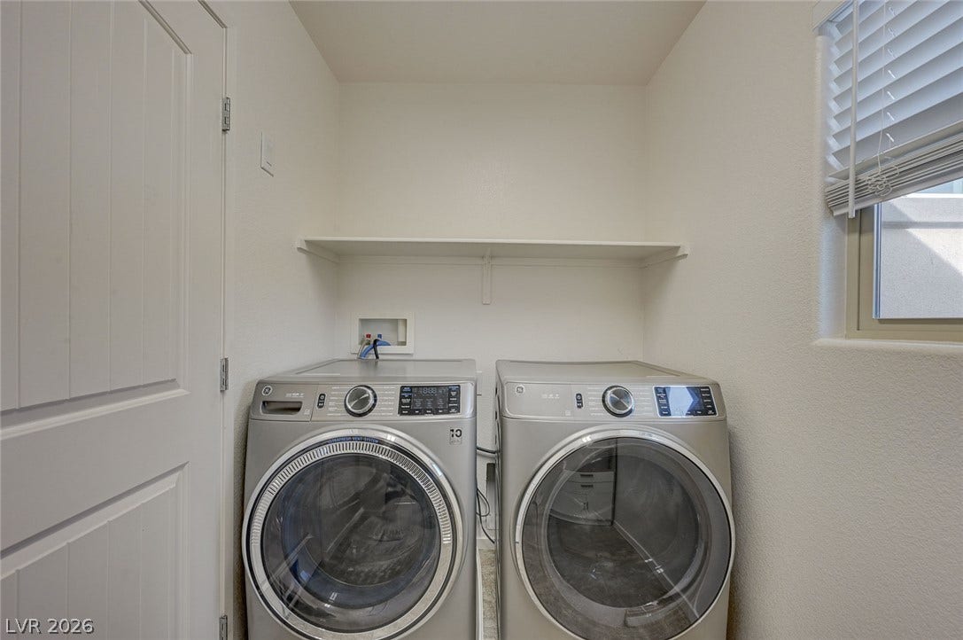 5608 Beckett Hill Court, Las Vegas, NV 89135 Functional utility space features overhead shelving alongside integrated laundry hookups.