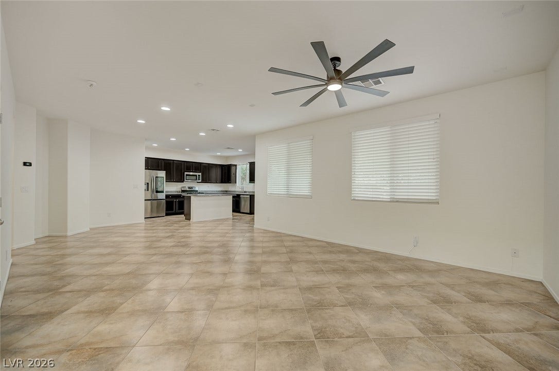 5608 Beckett Hill Court, Las Vegas, NV 89135 Tile flooring and an open layout connect the main living area directly to the kitchen.