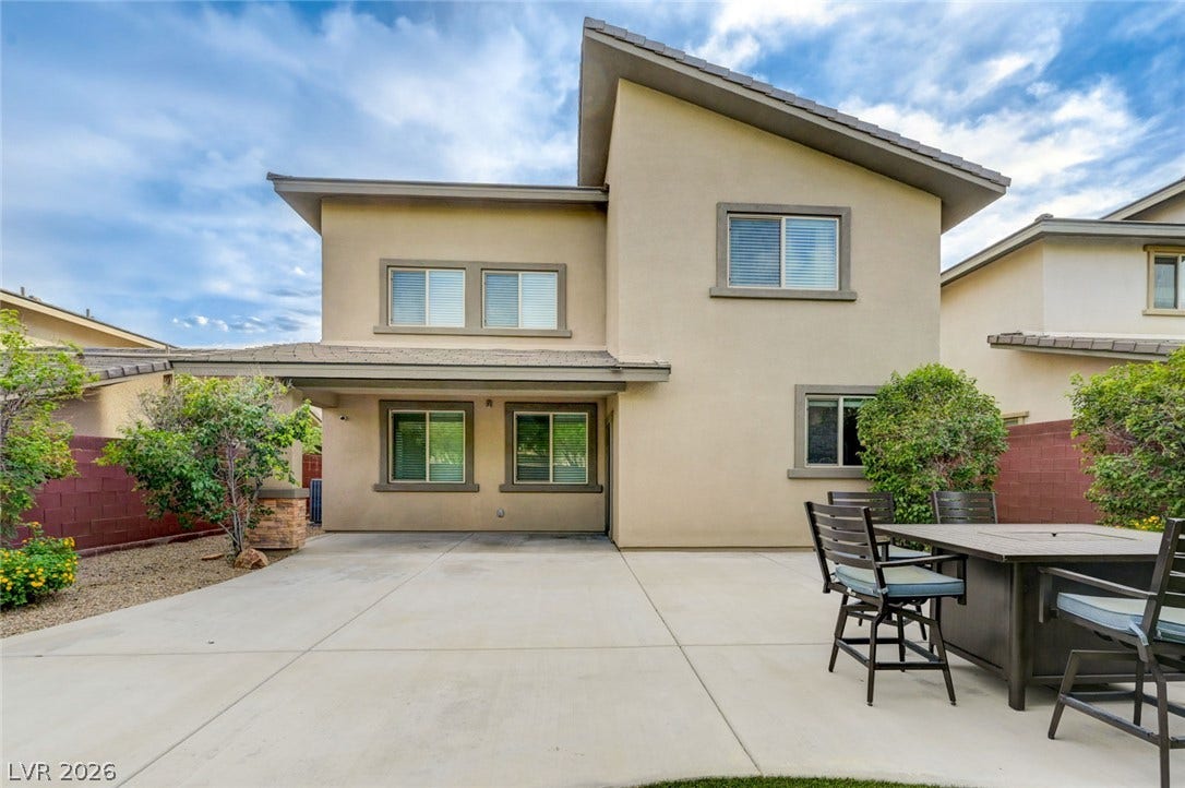 5608 Beckett Hill Court, Las Vegas, NV 89135 An expansive concrete patio extends along the rear of this contemporary stucco home.