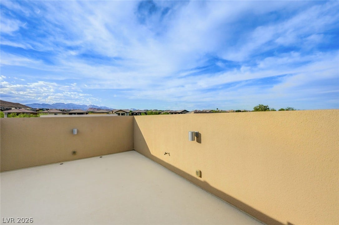 5608 Beckett Hill Court, Las Vegas, NV 89135 Panoramic mountain and neighborhood views await from this elevated rooftop deck.