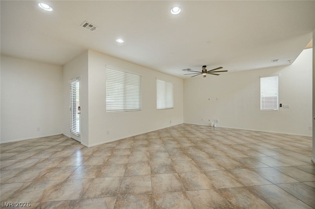 5608 Beckett Hill Court, Las Vegas, NV 89135 Clean tile flooring complements the neutral walls and recessed lighting in this open space.
