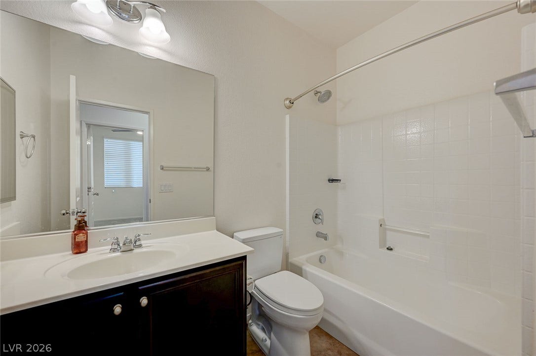 5608 Beckett Hill Court, Las Vegas, NV 89135 Clean lines and classic tiling define this well-appointed full bathroom.