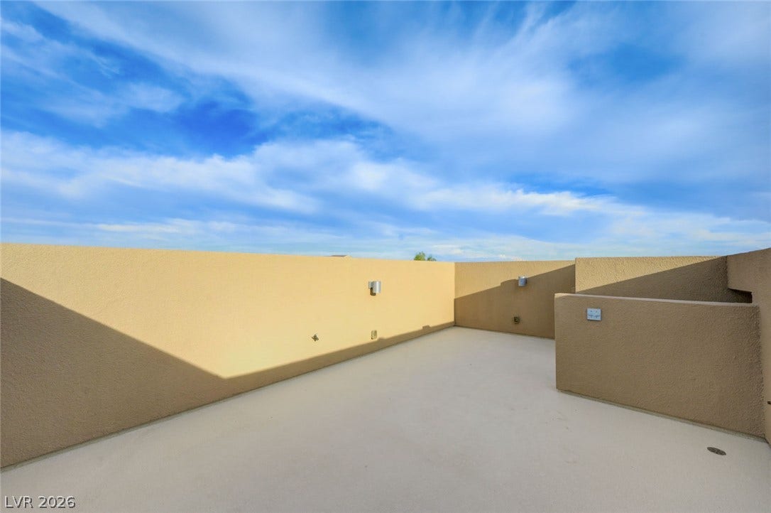 5608 Beckett Hill Court, Las Vegas, NV 89135 An open roof deck offers private outdoor space set against a wide blue sky.