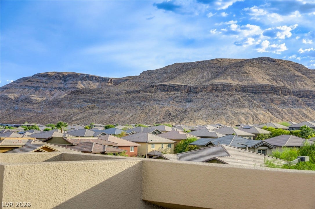 5608 Beckett Hill Court, Las Vegas, NV 89135 Dramatic mountain vistas rise above the surrounding neighborhood rooftops.