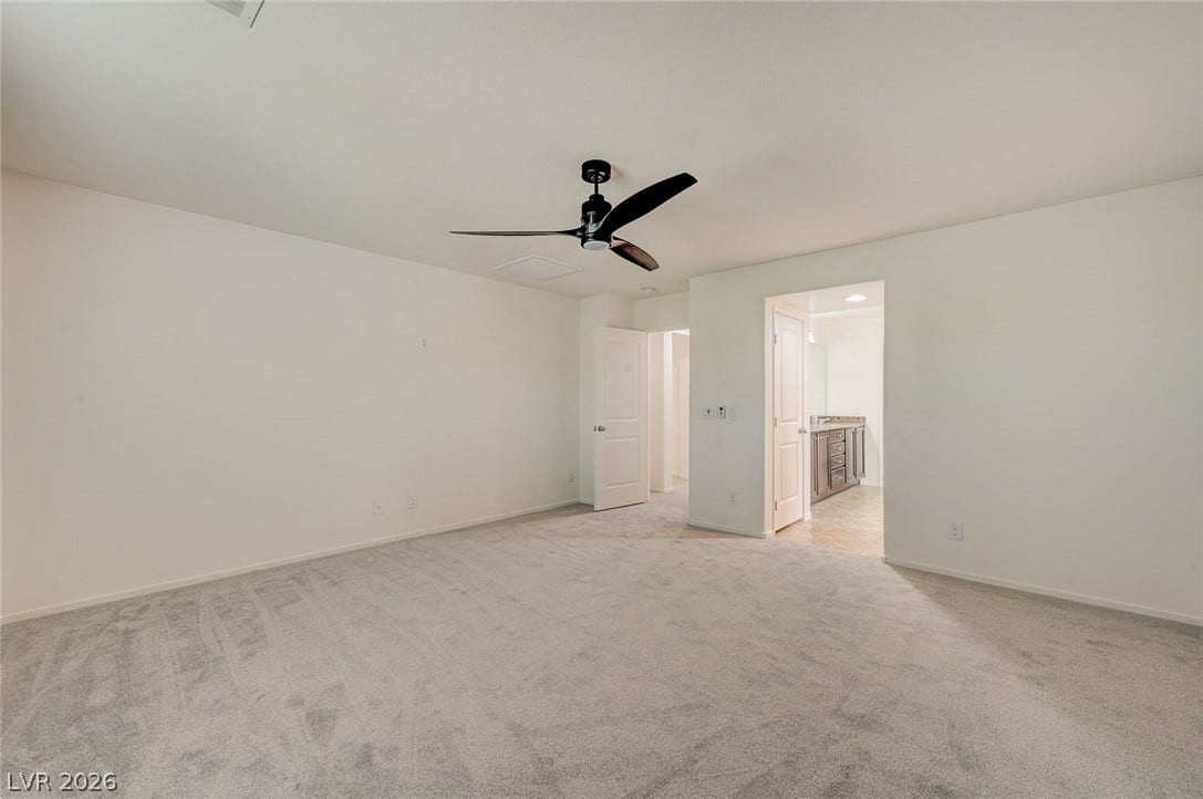 5608 Beckett Hill Court, Las Vegas, NV 89135 Soft carpeting underfoot creates a comfortable foundation for this bedroom retreat.