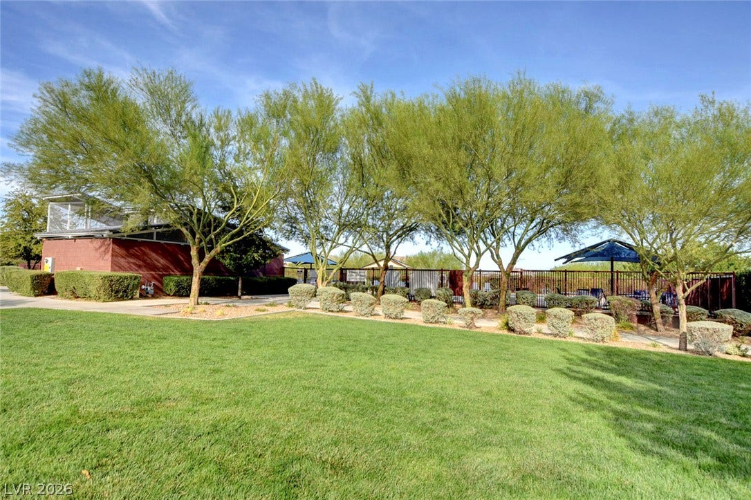 5608 Beckett Hill Court, Las Vegas, NV 89135 Lush green lawns and mature trees frame the community recreation facilities.