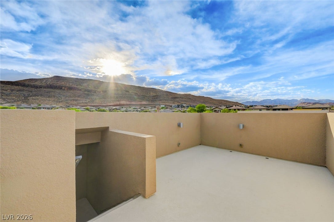5608 Beckett Hill Court, Las Vegas, NV 89135 Panoramic mountain and neighborhood views unfold from this elevated rooftop deck.