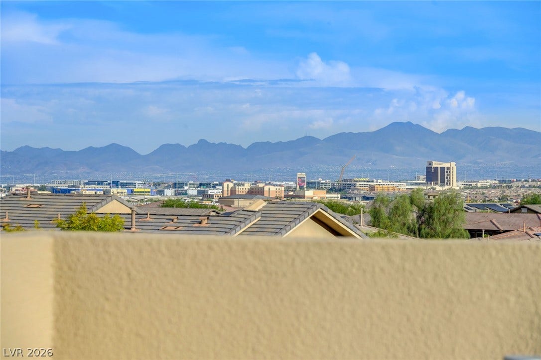 5608 Beckett Hill Court, Las Vegas, NV 89135 Distant mountain ranges and city lights frame the horizon from this elevated vantage point.