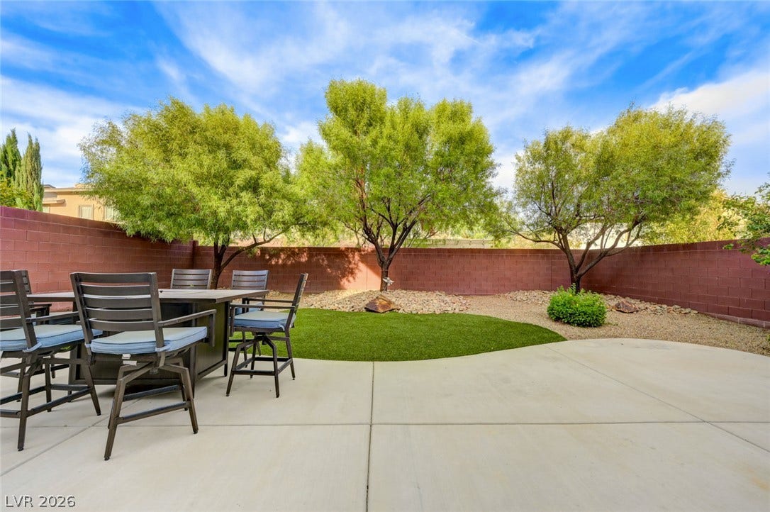 5608 Beckett Hill Court, Las Vegas, NV 89135 Mature trees line the privacy wall of this clean, low-maintenance backyard retreat.