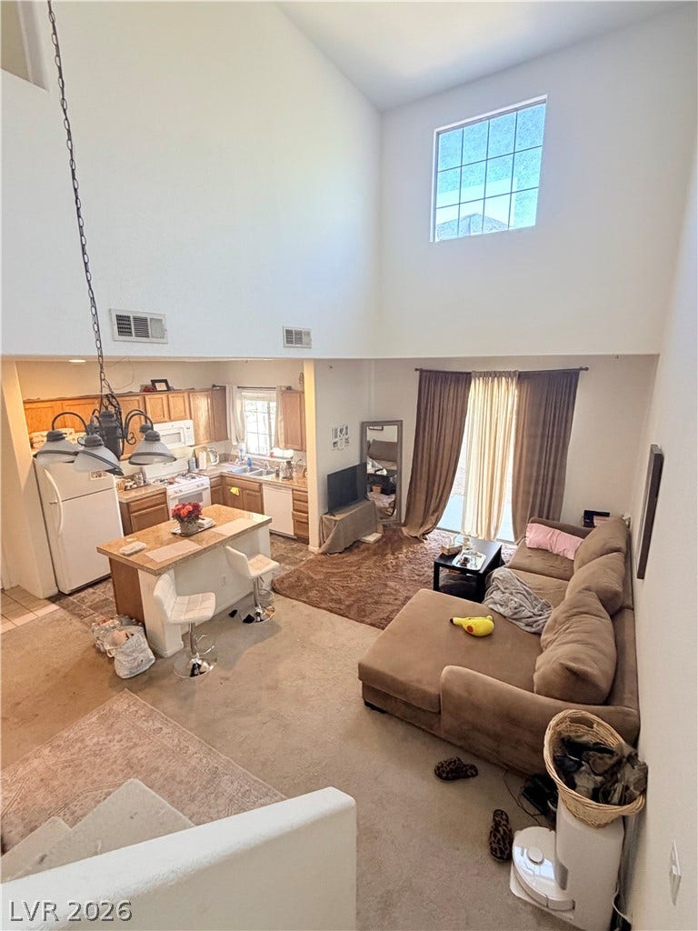 6408 Yucca Ridge Court, North Las Vegas, NV 89084 Towering ceilings and an open-concept design connect the main living spaces seamlessly.