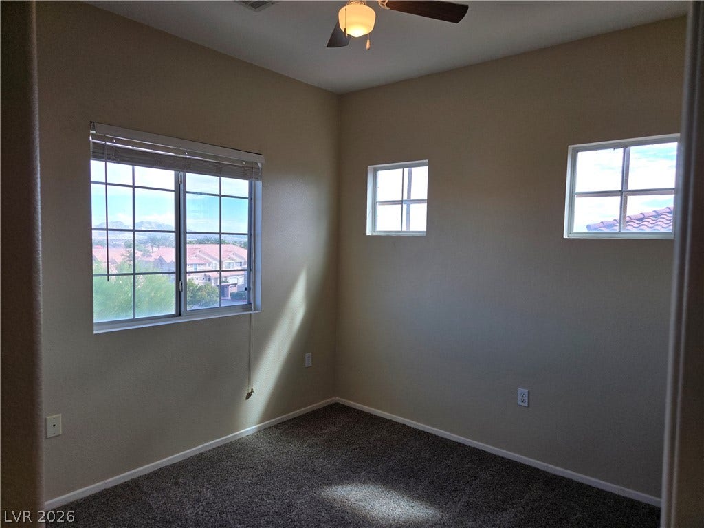 5935 Nuevo Leon Street, #2, North Las Vegas, NV 89031 Multiple windows draw natural light into this versatile secondary bedroom featuring wall-to-wall carpeting.