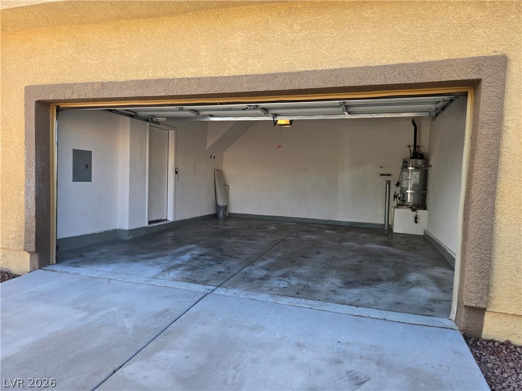 5935 Nuevo Leon Street, #2, North Las Vegas, NV 89031 An attached two-car garage features a durable concrete floor and a direct interior entryway.