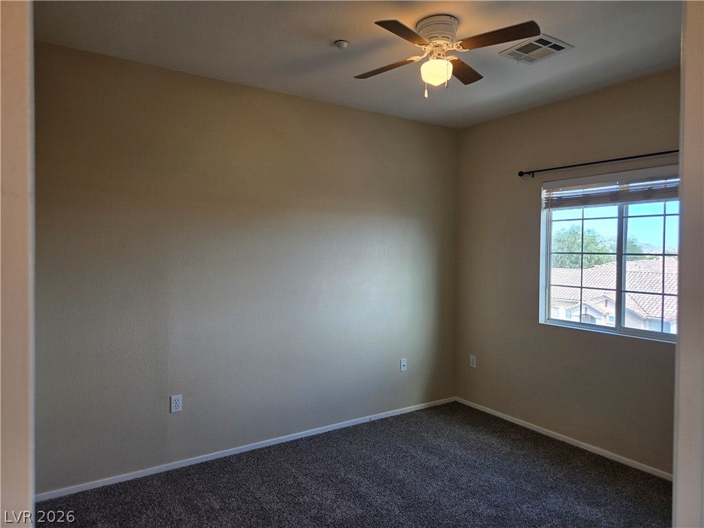 5935 Nuevo Leon Street, #2, North Las Vegas, NV 89031 Plush carpeting and natural light define this cozy secondary bedroom.