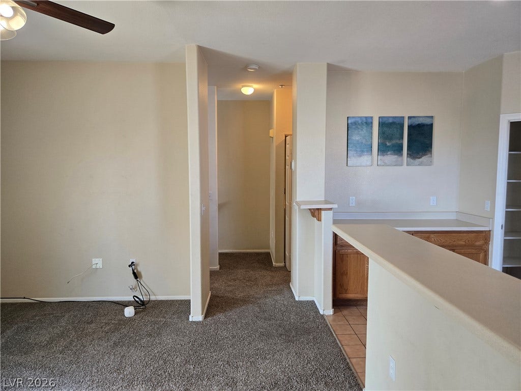 5935 Nuevo Leon Street, #2, North Las Vegas, NV 89031 An open floor plan connects the comfortable living spaces with warm wood cabinetry.
