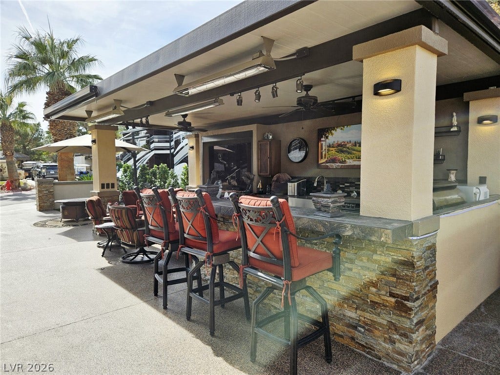 8175 Arville Street, #287, Las Vegas, NV 89139 A stone-accented outdoor bar sits under a covered pavilion on a concrete patio.