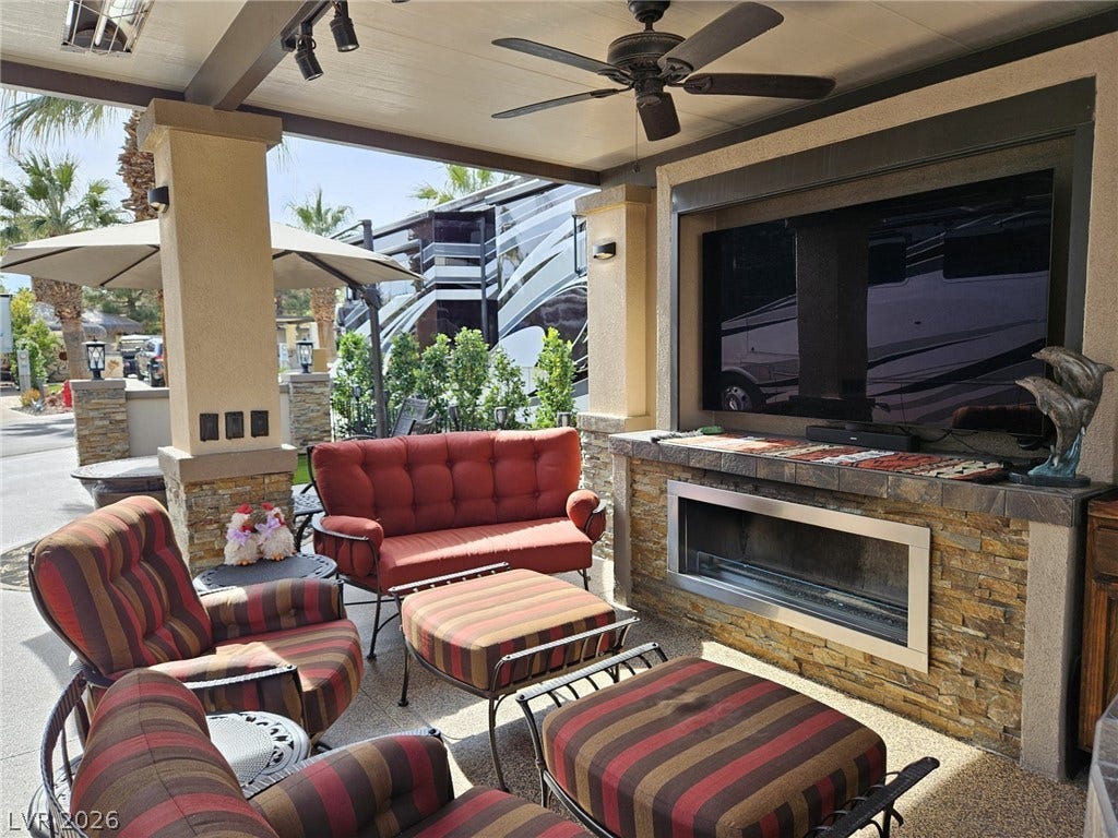 8175 Arville Street, #287, Las Vegas, NV 89139 A stone fireplace and high wood ceiling frame this inviting outdoor living area.