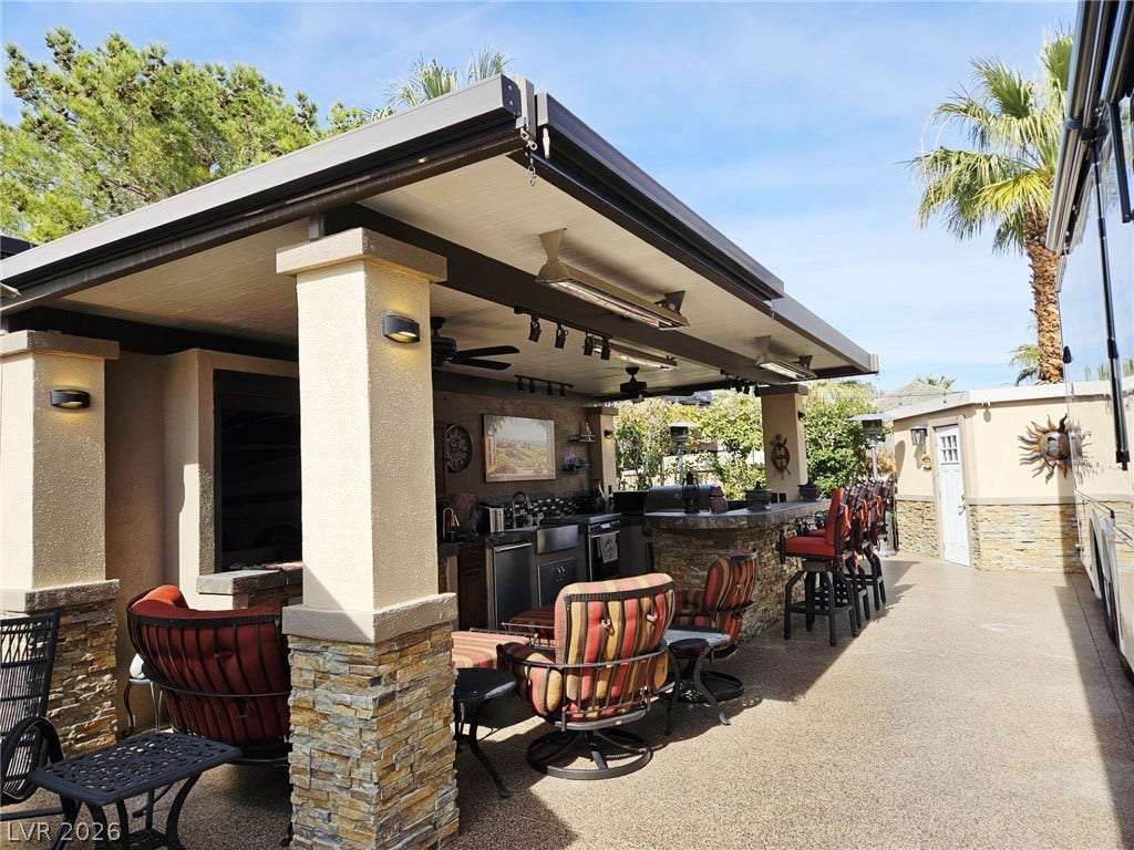 8175 Arville Street, #287, Las Vegas, NV 89139 An inviting covered outdoor kitchen and bar structure provides the ultimate backyard entertaining space.