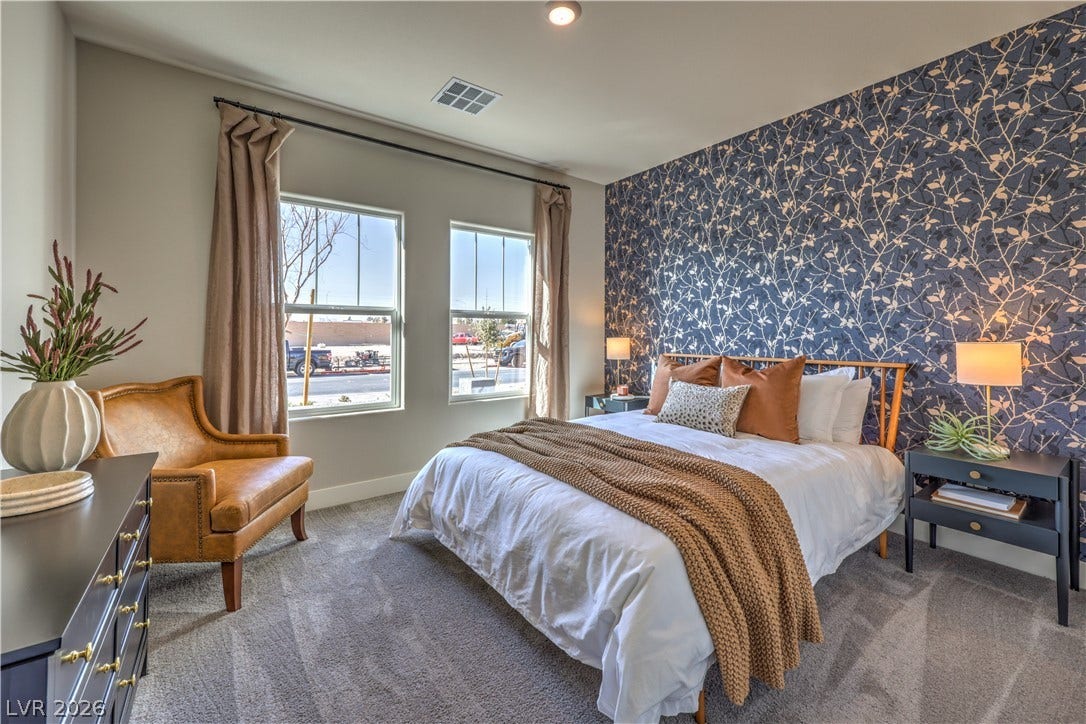 1044 Gentle Swan Street, Henderson, NV 89011 Plush carpeting and natural light from dual windows define this comfortable bedroom space. Photo is of actual model home for sale.