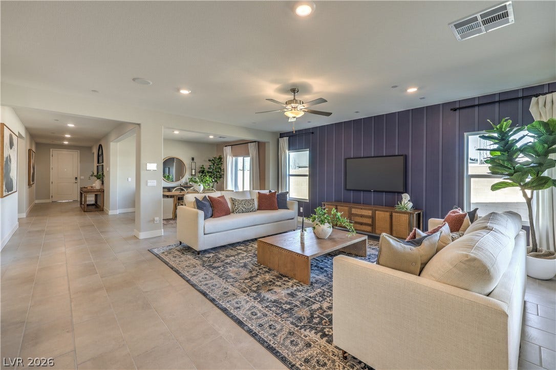 1044 Gentle Swan Street, Henderson, NV 89011 An open floorplan seamlessly connects the airy living spaces and tiled corridors. Photo is of actual model home for sale.