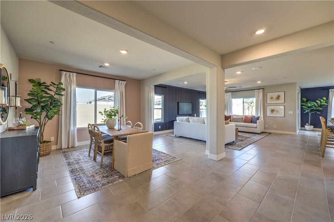 1044 Gentle Swan Street, Henderson, NV 89011 An open floorplan seamlessly connects the airy dining space to the main living areas. Photo is of actual model home for sale.