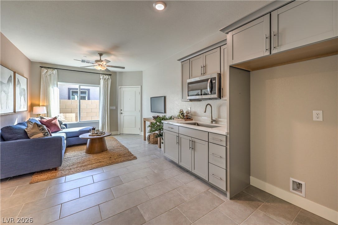 1044 Gentle Swan Street, Henderson, NV 89011 Clean tile flooring flows seamlessly from the kitchen area into the open living space. Multi-Gen suite with own entrance!