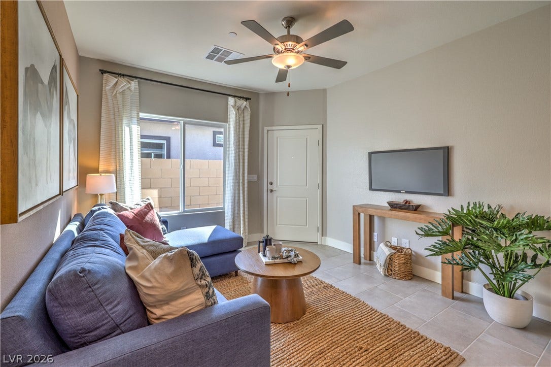 1044 Gentle Swan Street, Henderson, NV 89011 Tiled flooring and natural light create a welcoming living space. Photo is of actual model home for sale.