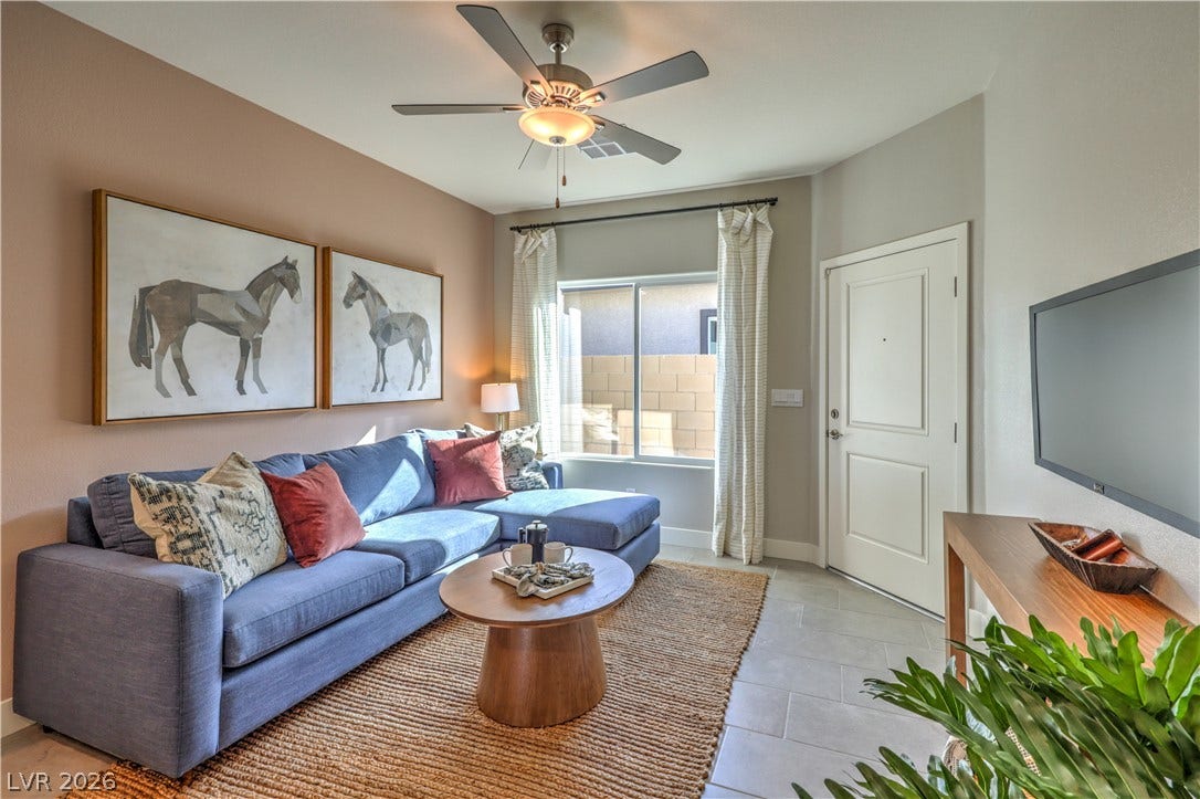 1044 Gentle Swan Street, Henderson, NV 89011 Tiled flooring and a large window create an inviting atmosphere in this cozy space. Multi Gen sitting area. Photo is of actual model home for sale.