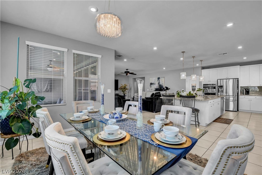 6834 Moorland Street, North Las Vegas, NV 89084 An open-concept layout seamlessly connects the dining room and kitchen spaces.