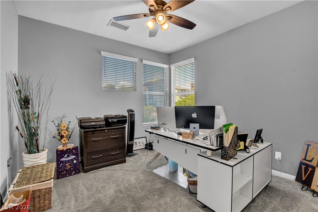 6834 Moorland Street, North Las Vegas, NV 89084 Plentiful natural light from multiple windows highlights the plush carpeting in this versatile office space.