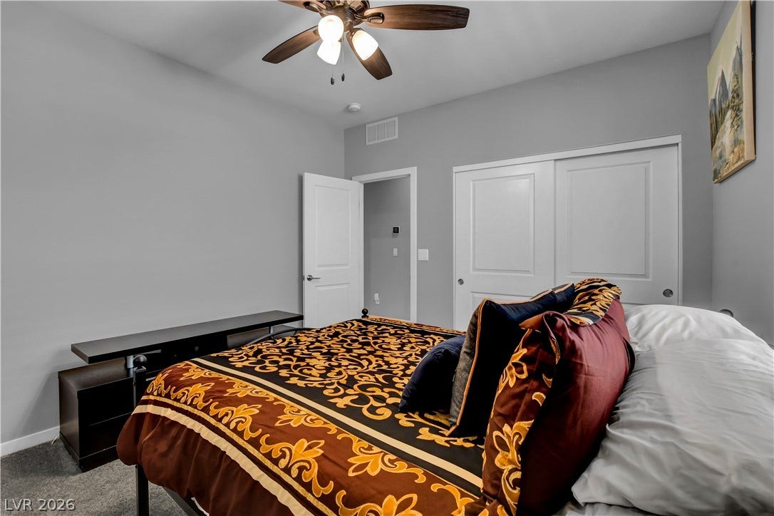 6834 Moorland Street, North Las Vegas, NV 89084 Smooth neutral walls and plush carpeting anchor this comfortable sleeping space.