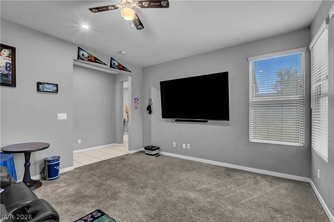 6834 Moorland Street, North Las Vegas, NV 89084 Plentiful natural light filters through windows into a comfortable space lined with plush carpeting.