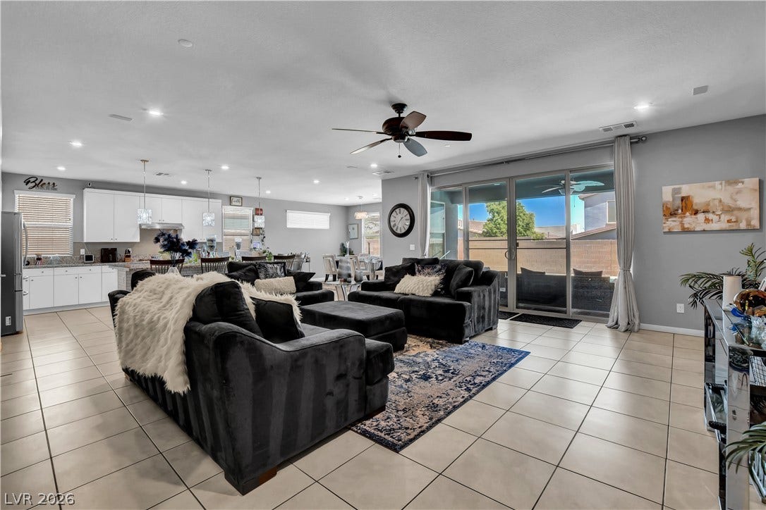 6834 Moorland Street, North Las Vegas, NV 89084 An open floor plan seamlessly connects the central living area with the adjacent kitchen.