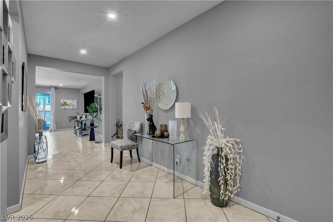 6834 Moorland Street, North Las Vegas, NV 89084 Polished tile flooring and recessed lighting define this welcoming entry gallery.