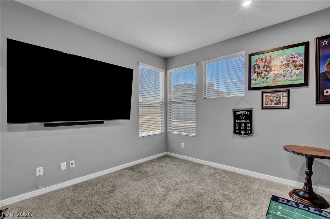 6834 Moorland Street, North Las Vegas, NV 89084 Thick wall-to-wall carpeting and multiple large windows define this versatile secondary room.
