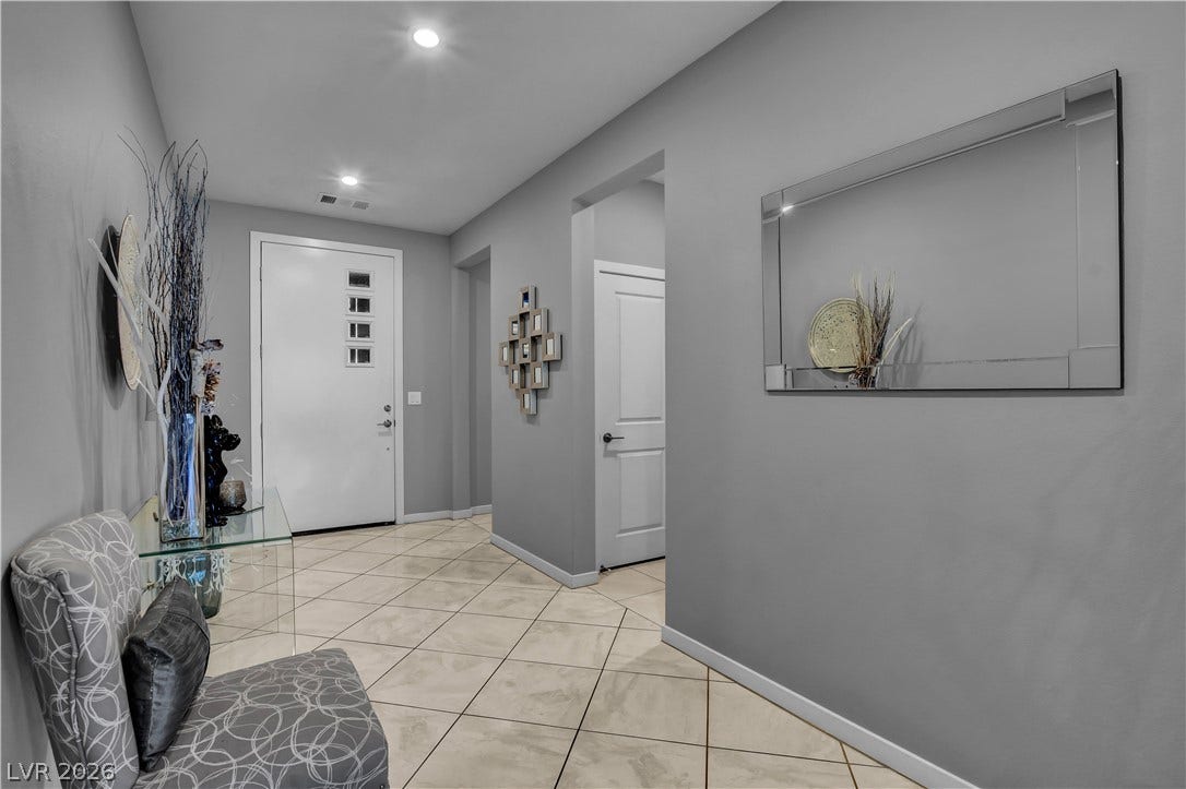 6834 Moorland Street, North Las Vegas, NV 89084 Polished tile flooring and recessed lighting create a welcoming entry hall.