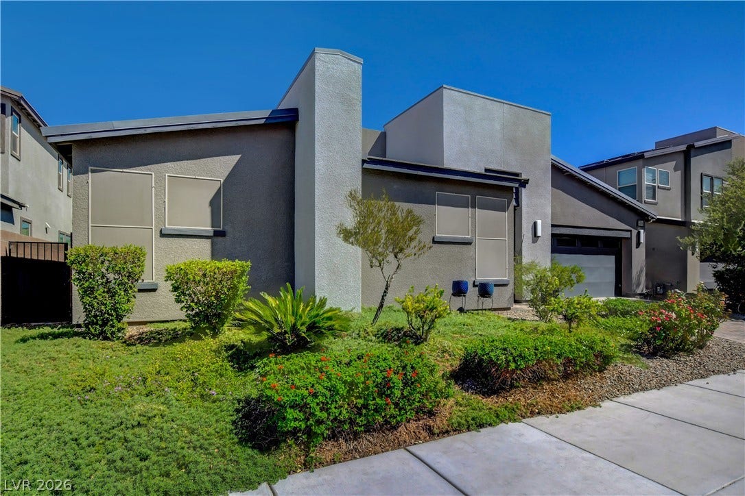 6834 Moorland Street, North Las Vegas, NV 89084 Clean lines and manicured desert landscaping define this modern home exterior.