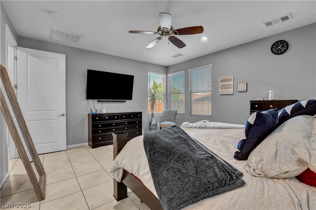 6834 Moorland Street, North Las Vegas, NV 89084 Tiled flooring and multiple windows bring simple comfort to this restful space.